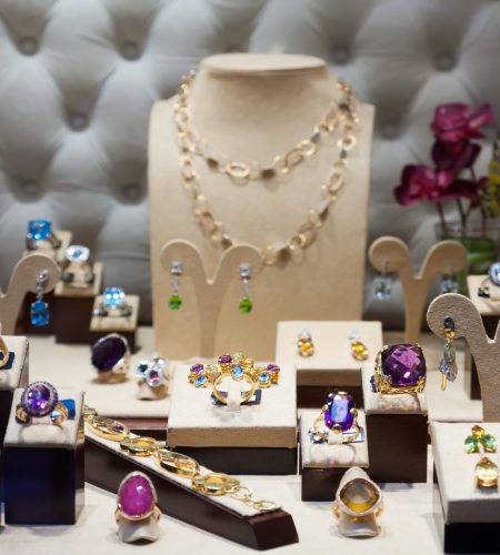 jewelry with gems at showcase of shop